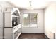 Cozy dining area features a stylish hutch and ample natural light, creating a warm and inviting space for meals and gatherings at 4925 S 5Th Ave, Phoenix, AZ 85041