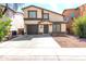 Inviting two-story home with an attached garage and a well-manicured front yard, offering a blend of comfort and curb appeal at 4925 S 5Th Ave, Phoenix, AZ 85041