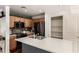 Bright kitchen featuring wooden cabinets, a central island, and modern appliances, creating a functional and inviting culinary space at 4925 S 5Th Ave, Phoenix, AZ 85041