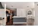 Open-concept kitchen with a central island, wooden cabinetry, and modern appliances, blending style and practicality for everyday living at 4925 S 5Th Ave, Phoenix, AZ 85041