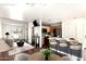 Open-concept living room with a modern kitchen featuring a central island and stylish seating, creating a perfect space for entertaining at 4925 S 5Th Ave, Phoenix, AZ 85041