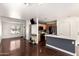 Modern living space with a connected kitchen island and ample natural light, creating an open and inviting atmosphere for relaxation at 4925 S 5Th Ave, Phoenix, AZ 85041