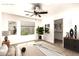 Spacious main bedroom with ceiling fan, large window, and a walk-in closet at 4925 S 5Th Ave, Phoenix, AZ 85041