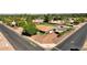 Aerial view of the property showcasing the pool, green space, and landscaping at 5112 E Cholla St, Scottsdale, AZ 85254