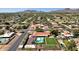 Charming single-story home with a refreshing pool and lush green lawn in a serene neighborhood at 5112 E Cholla St, Scottsdale, AZ 85254