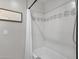 Bright bathroom boasts classic white subway tiles, a bathtub, and decorative accent tiling at 5112 E Cholla St, Scottsdale, AZ 85254