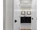 Bathroom featuring dual vanities with framed mirrors, black cabinets, and patterned tile floors at 5112 E Cholla St, Scottsdale, AZ 85254