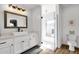 Bright bathroom with a glass-enclosed shower, a stylish vanity, and a toilet, offering a clean aesthetic at 5112 E Cholla St, Scottsdale, AZ 85254