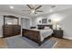 Bedroom featuring a wooden bed frame, dresser, nightstands, and a ceiling fan at 5112 E Cholla St, Scottsdale, AZ 85254