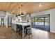 Modern kitchen featuring a large island, stainless steel appliances, and seamless access to the pool at 5112 E Cholla St, Scottsdale, AZ 85254