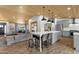 Spacious kitchen with a center island, stylish pendant lighting, and stainless steel appliances at 5112 E Cholla St, Scottsdale, AZ 85254