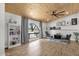 Cozy living room featuring wood-look tile flooring, natural light, and a ceiling fan at 5112 E Cholla St, Scottsdale, AZ 85254