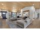 Spacious living room with wood-look tile flooring, recessed lighting, and a comfortable sofa at 5112 E Cholla St, Scottsdale, AZ 85254