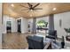 Comfortable living area with natural light, wood-look tile flooring, and stylish furniture at 5112 E Cholla St, Scottsdale, AZ 85254