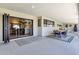 Covered patio includes an outdoor dining set and a folding door opening to the home's interior at 5112 E Cholla St, Scottsdale, AZ 85254