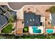 Aerial view of property with pool, putting green, and well-manicured landscaping at 5827 E Larkspur Dr, Scottsdale, AZ 85254