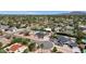Wide aerial perspective of the community highlighting the houses and lush greenery at 5827 E Larkspur Dr, Scottsdale, AZ 85254