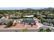 Aerial view of the property showing the house, pool, and surrounding neighborhood at 5827 E Larkspur Dr, Scottsdale, AZ 85254