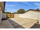 Spacious backyard area featuring a large concrete pad and a gated entrance at 5827 E Larkspur Dr, Scottsdale, AZ 85254