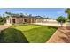 Backyard showcasing a putting green, pool and covered patio space, perfect for entertaining at 5827 E Larkspur Dr, Scottsdale, AZ 85254