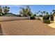 Spacious backyard area with desert landscaping and privacy wall at 5827 E Larkspur Dr, Scottsdale, AZ 85254