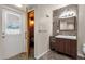 Well-lit bathroom with a sleek vanity and a door leading to a sauna for relaxation and rejuvenation at 5827 E Larkspur Dr, Scottsdale, AZ 85254