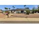 Charming single-story home with desert landscaping, offering curb appeal and a low-maintenance yard at 5827 E Larkspur Dr, Scottsdale, AZ 85254