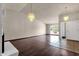Spacious living room showcasing hardwood floors, vaulted ceilings, and modern lighting at 5827 E Larkspur Dr, Scottsdale, AZ 85254
