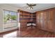 Well-lit office space featuring custom wood built-ins, cabinets, and desk area at 5827 E Larkspur Dr, Scottsdale, AZ 85254