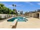 Backyard swimming pool with diving board and mature landscaping for serene outdoor living at 5827 E Larkspur Dr, Scottsdale, AZ 85254