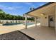 Inviting covered patio overlooking the backyard oasis with a sparkling pool at 5827 E Larkspur Dr, Scottsdale, AZ 85254