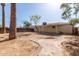 A spacious backyard with a brick pathway and lush tree coverage at 6139 N 31St Dr, Phoenix, AZ 85017