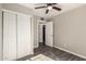 Clean bedroom featuring wood floors and a sliding door closet at 6139 N 31St Dr, Phoenix, AZ 85017
