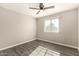 Sunny bedroom featuring wood floors, ceiling fan and view at 6139 N 31St Dr, Phoenix, AZ 85017