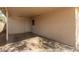 Spacious carport area with concrete flooring and a door leading to interior at 6139 N 31St Dr, Phoenix, AZ 85017