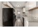 Updated kitchen features granite countertops, white cabinets, and stainless steel appliances at 6139 N 31St Dr, Phoenix, AZ 85017