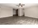 Open living room with modern wood-look flooring and a ceiling fan at 6139 N 31St Dr, Phoenix, AZ 85017