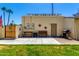 A well-maintained backyard has a cozy patio with a seating area and barbecue, perfect for relaxing outdoors at 630 E Jensen St # 154, Mesa, AZ 85203