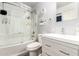 Clean bathroom with modern vanity, toilet, and shower/tub combination with glass sliding doors at 630 E Jensen St # 154, Mesa, AZ 85203