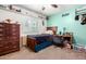 Cozy bedroom with a wood bed, desk, dresser, and natural light creates a comfortable personal space at 630 E Jensen St # 154, Mesa, AZ 85203