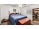 Comfortable bedroom featuring a large bed, light through window, and side shelf at 630 E Jensen St # 154, Mesa, AZ 85203