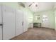 Bright bonus room with natural light, built in storage, and exterior door at 630 E Jensen St # 154, Mesa, AZ 85203