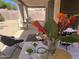 Covered patio features an outdoor dining table and seating arrangement, perfect for relaxation at 6626 W Monona Dr, Glendale, AZ 85308