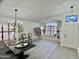 Bright dining room featuring white walls, plantation shutters, and decorative furnishings at 6626 W Monona Dr, Glendale, AZ 85308