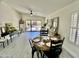 The dining room features a ceiling fan, vaulted ceilings, and access to the backyard at 6626 W Monona Dr, Glendale, AZ 85308