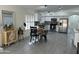 Open kitchen area features white cabinets and stainless steel appliances at 6626 W Monona Dr, Glendale, AZ 85308