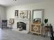 Living room featuring fireplace, decorative items, and tile floors at 6626 W Monona Dr, Glendale, AZ 85308