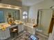 Bright main bathroom features double vanity, large soaking tub and glass enclosed shower at 6626 W Monona Dr, Glendale, AZ 85308