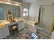 Bright main bathroom features double vanity, large soaking tub and glass enclosed shower at 6626 W Monona Dr, Glendale, AZ 85308