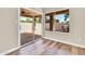 View of the covered patio and backyard with a barbeque grill from the light filled dining room at 6837 S Roosevelt St, Tempe, AZ 85283
